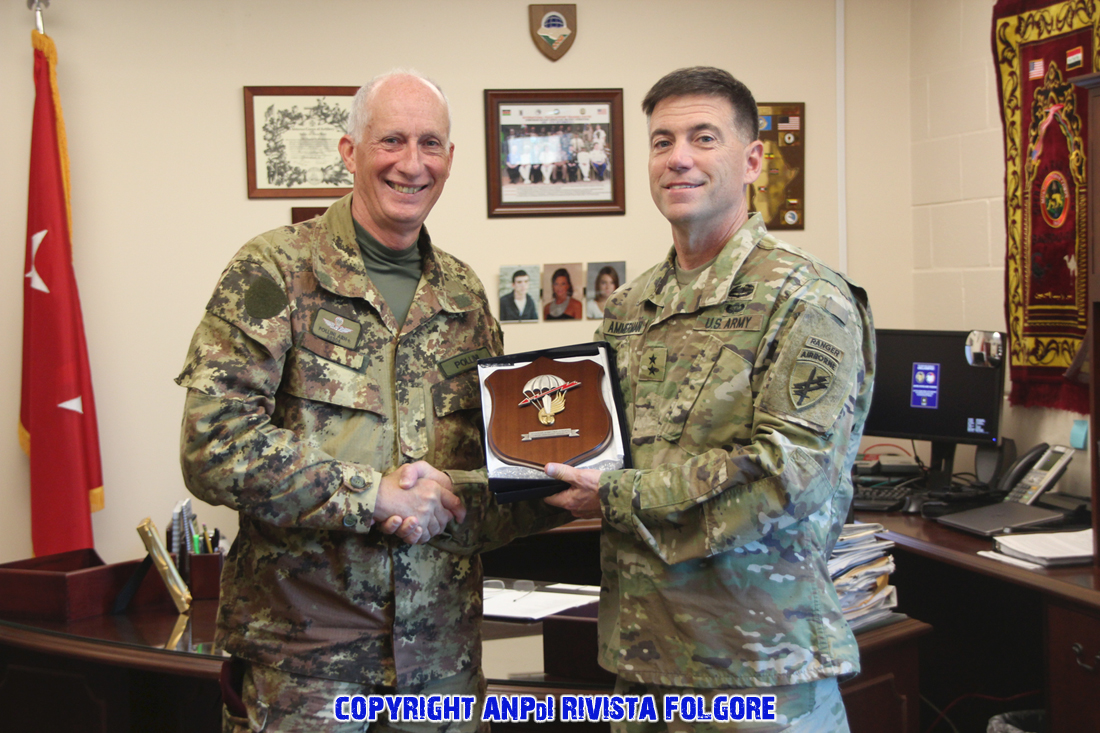 Columbian Jumpmasters formally thank Maj. Gen. David Ammerman, commanding general of United States Army Civil Affairs and Psychological Operations Command (Airborne) in Fort Bragg N.C. Dec 12, 2015. On behalf of USACAPOC(A), Ammerman also showed appreciation by thanking them for participating in Operation Toy Drop 2015. (U.S. Army photo by Pfc. Khadijah Wilcox/Released)